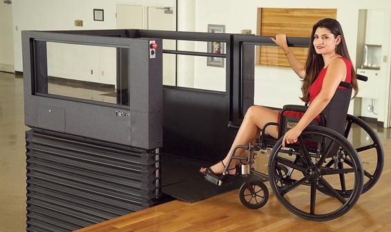 Woman using Ascension Virtuoso vertical wheelchair lift
